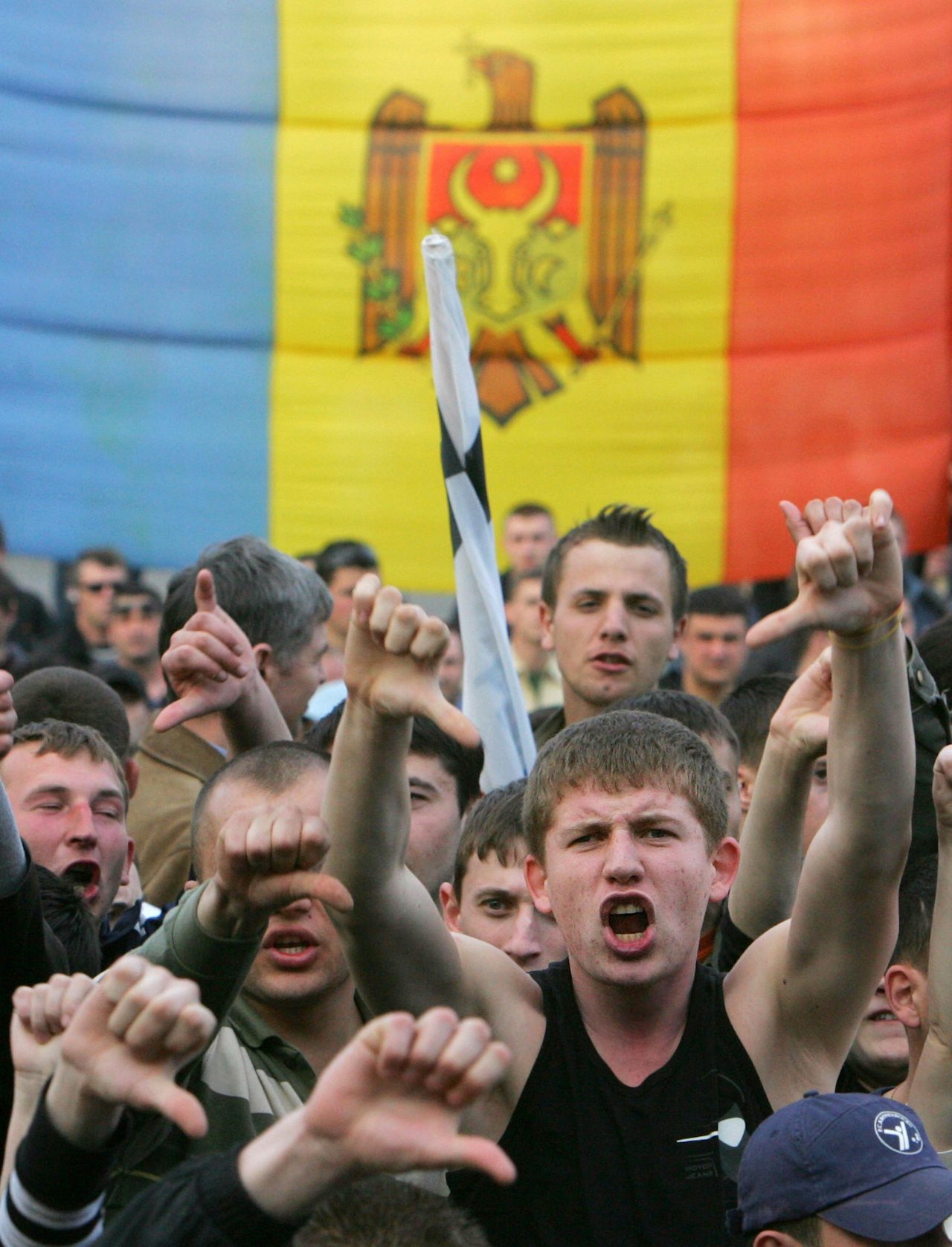 Protesters shout during a rally near a government building in Chisinau on April 8, 2009.