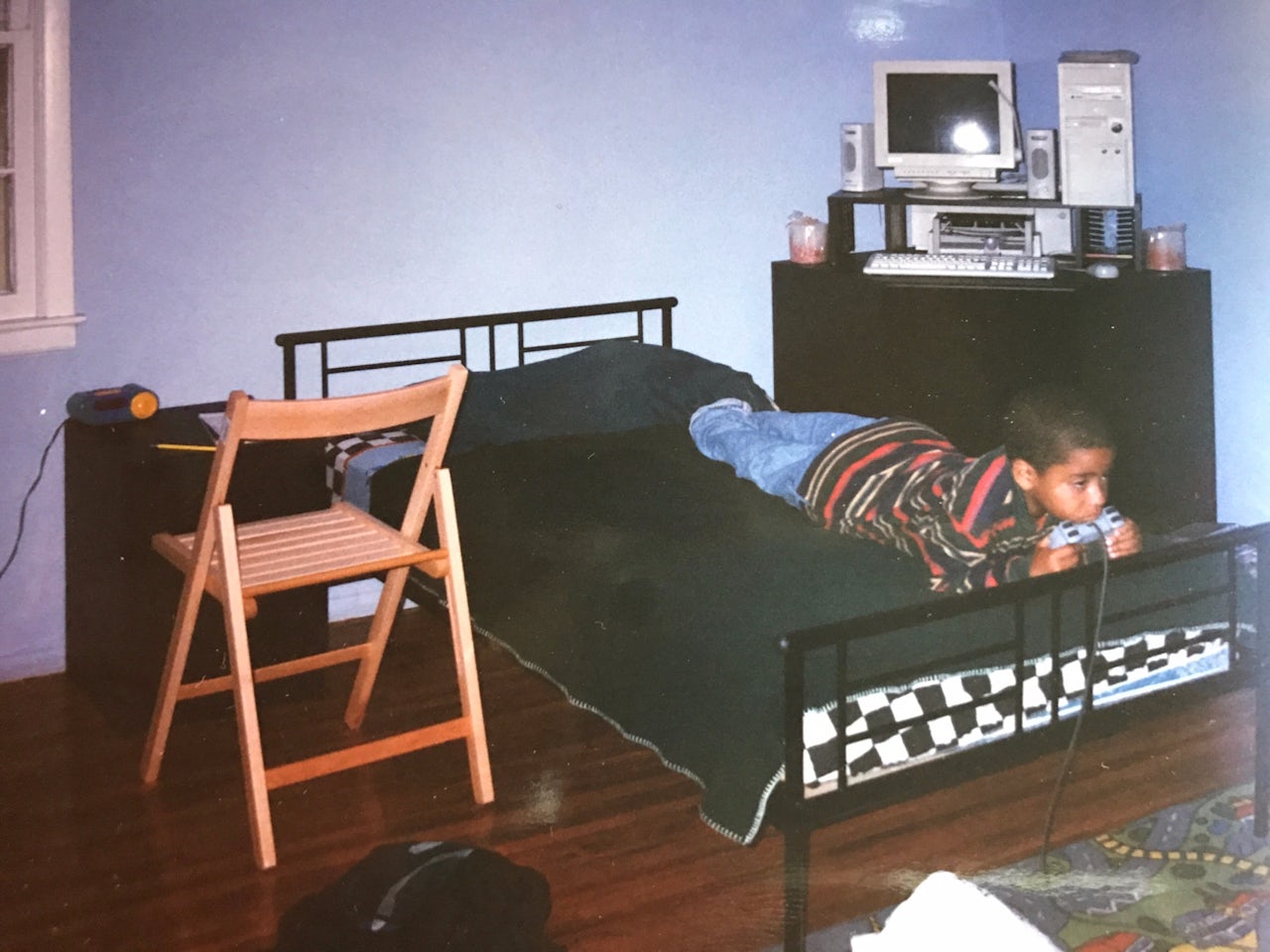 The author playing video games at 7 years old.