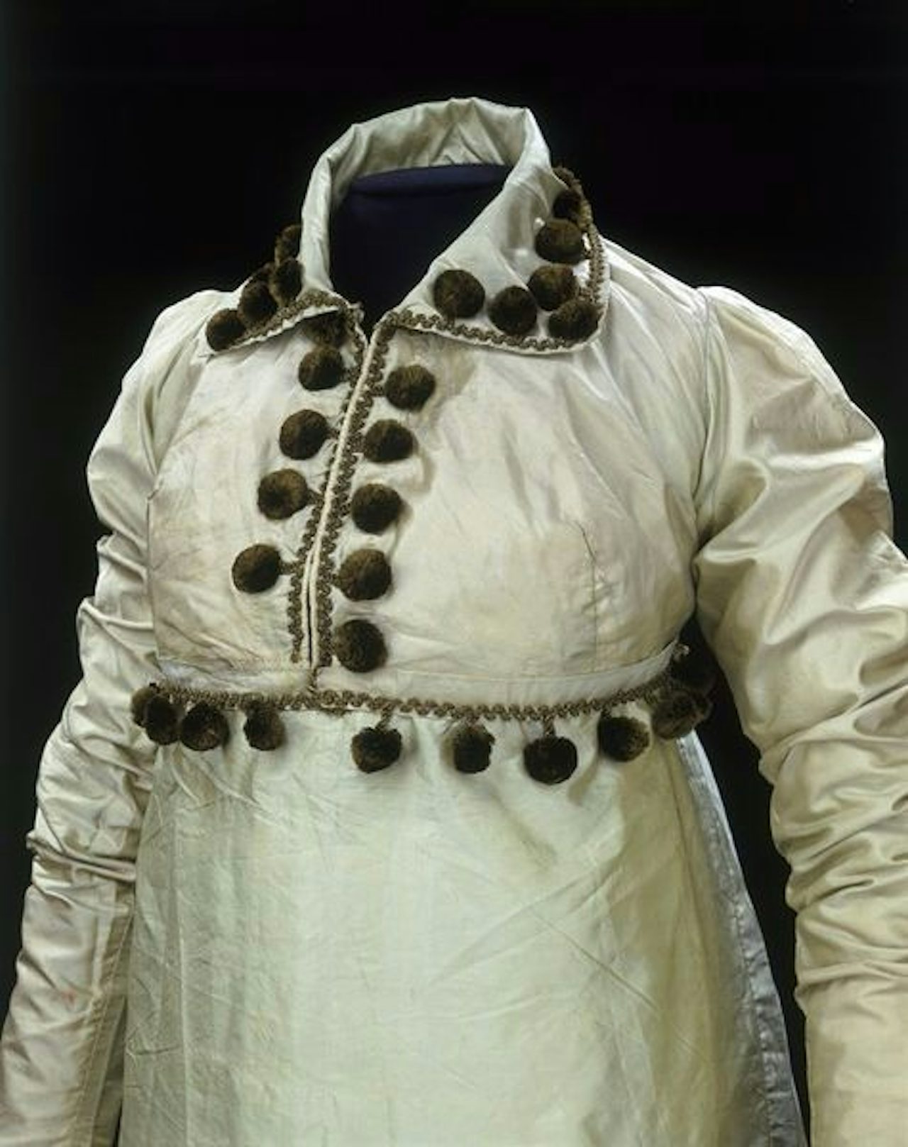 Dress from 1810 Great Britain with a pom-pom trim.
