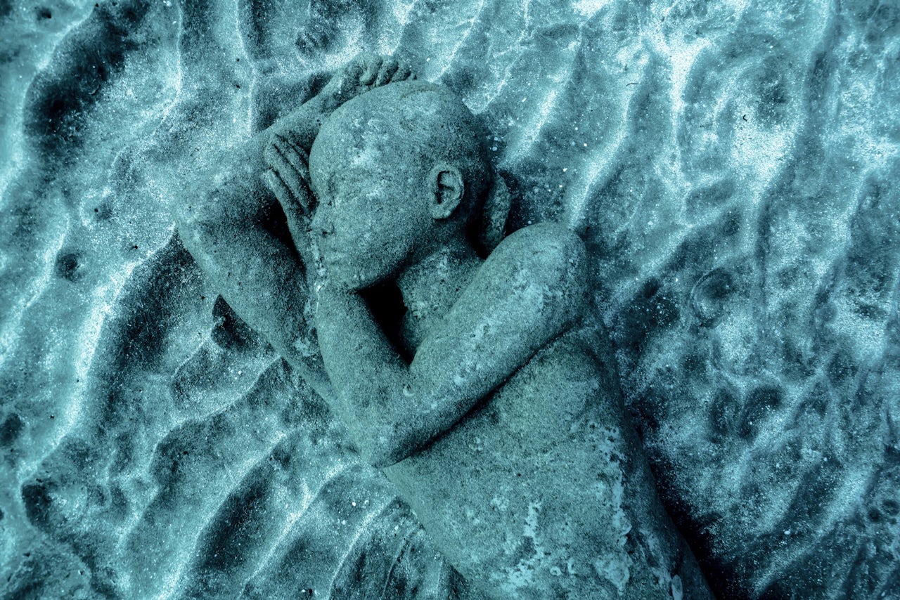 A statue cast from a local resident of Lanzarote lies on the seabed.