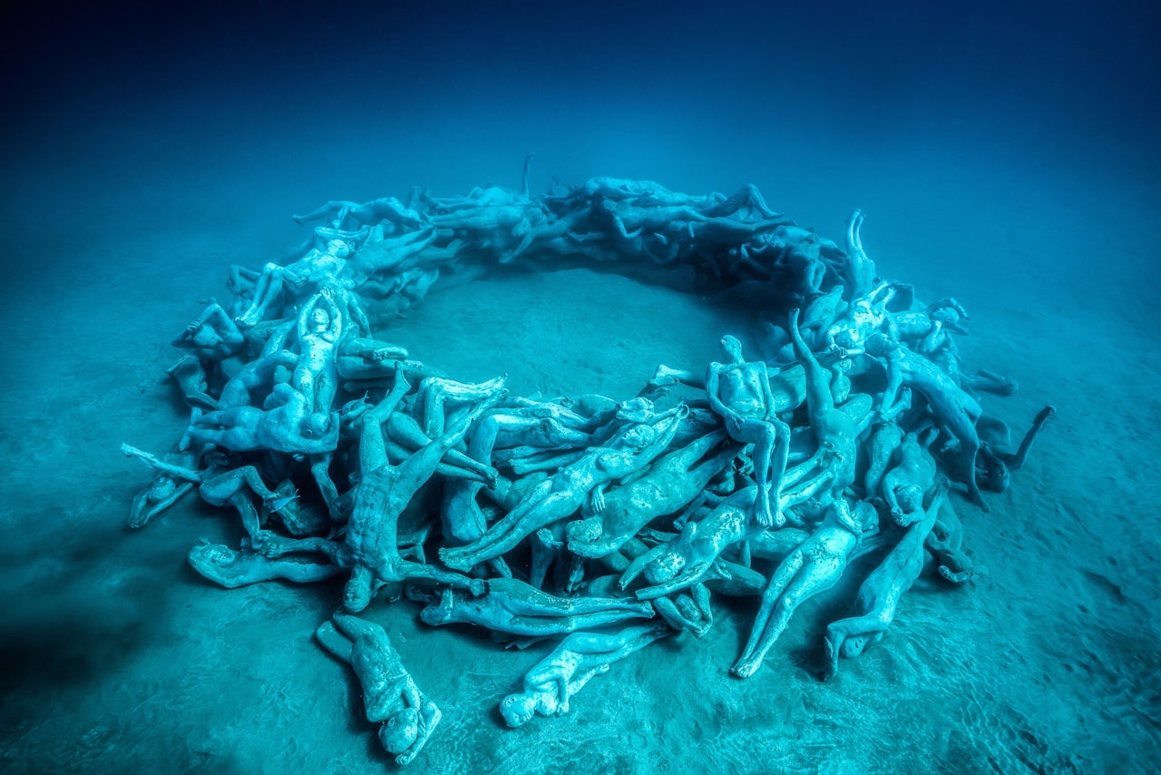 “The Human Gyre,” the final exhibit in the museum, consists of 200 figures which are arranged to encourage the growth of a large, circular reef.