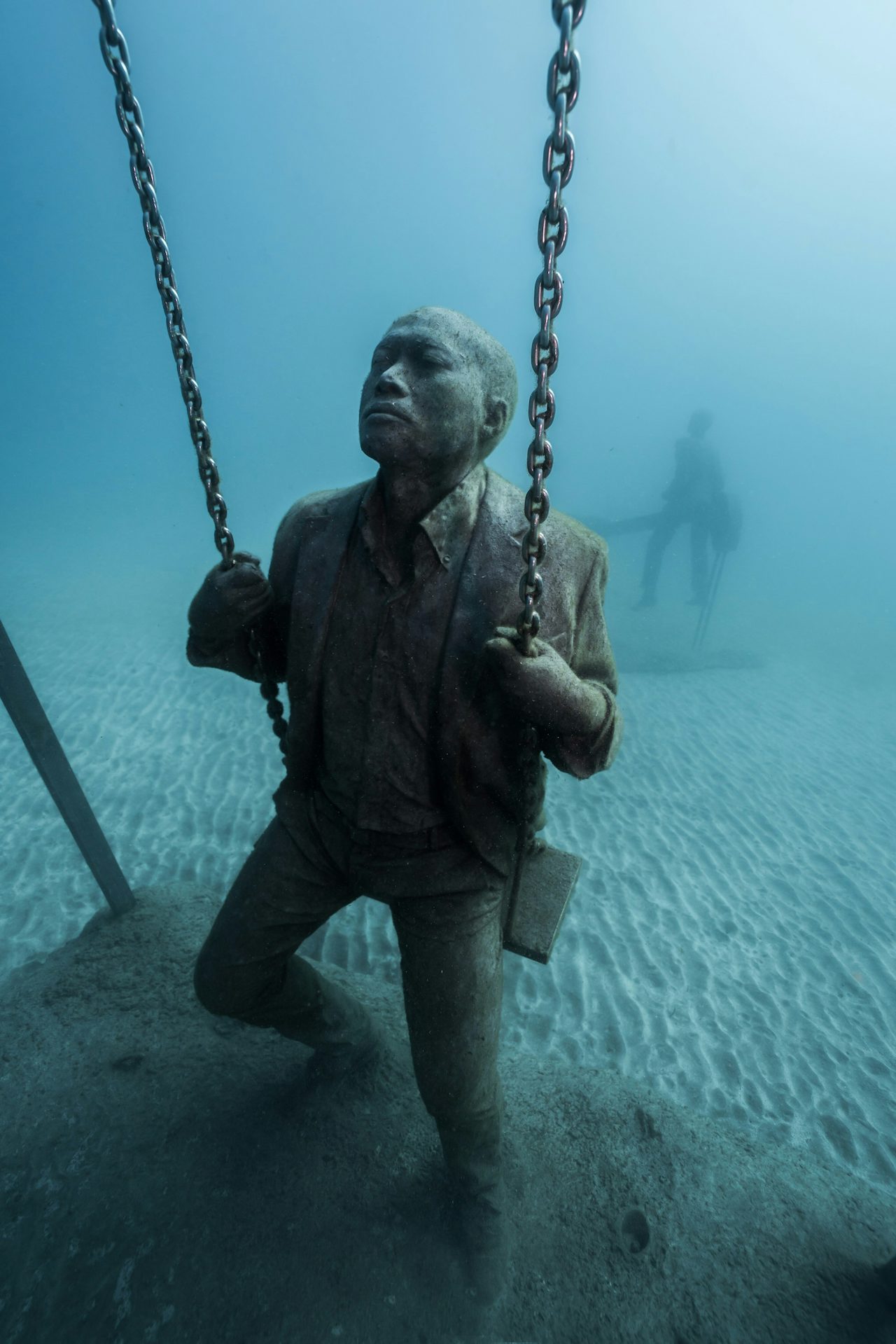 A part of the ‘Deregulated’ exhibit, which features businessmen playing on a playground.