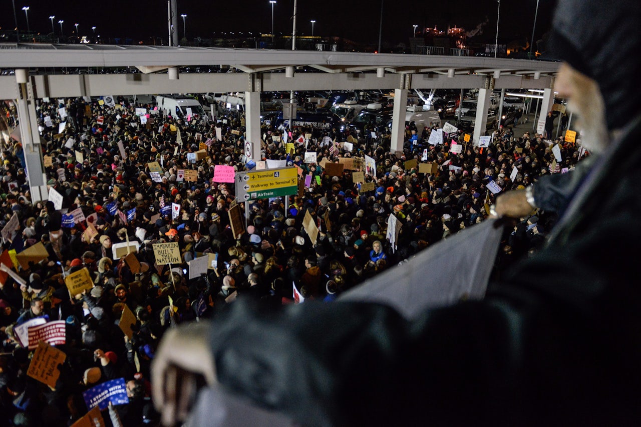 Protesters rally during a demonstration against the Muslim immigration ban at John F. Kennedy International Airport.
