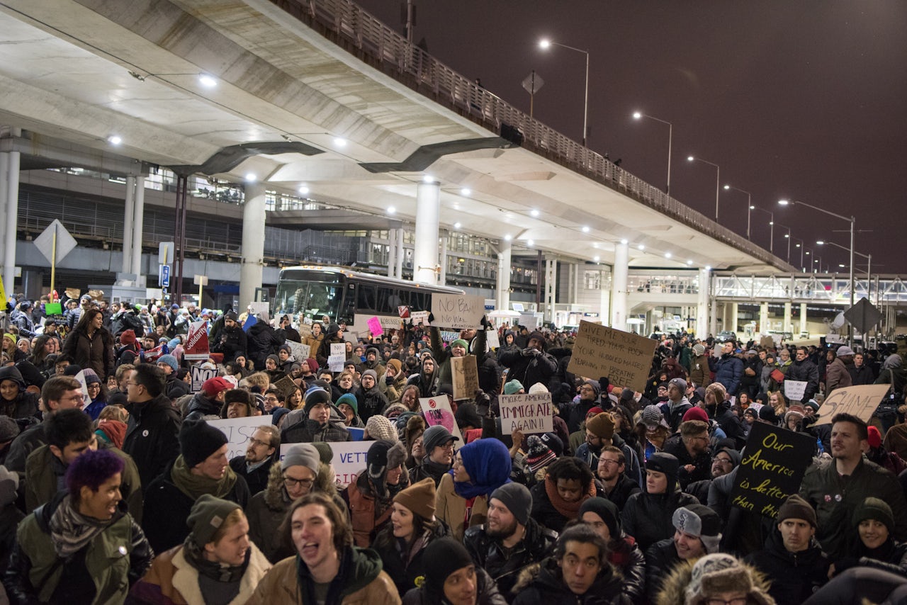 Thousands fill the street outside Terminal 5 of O'Hare International Airport in Chicago.