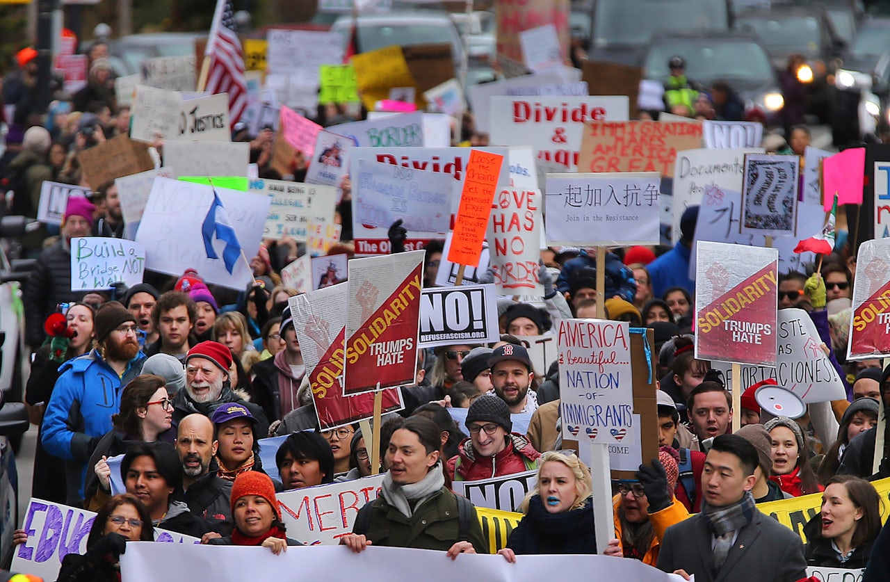 Hundreds of people gathered for a rally at the Chinatown Gate in Boston.
