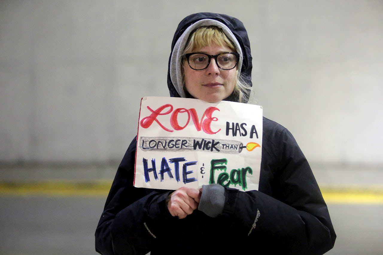 Demonstrators protest agaist President Trump's executive immigration ban at Chicago O'Hare International Airport.