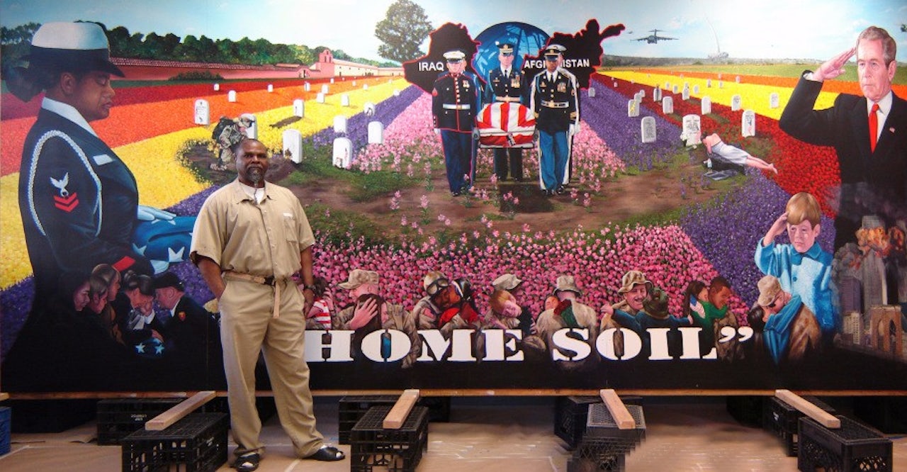 Fulton Washington with one of his paintings.