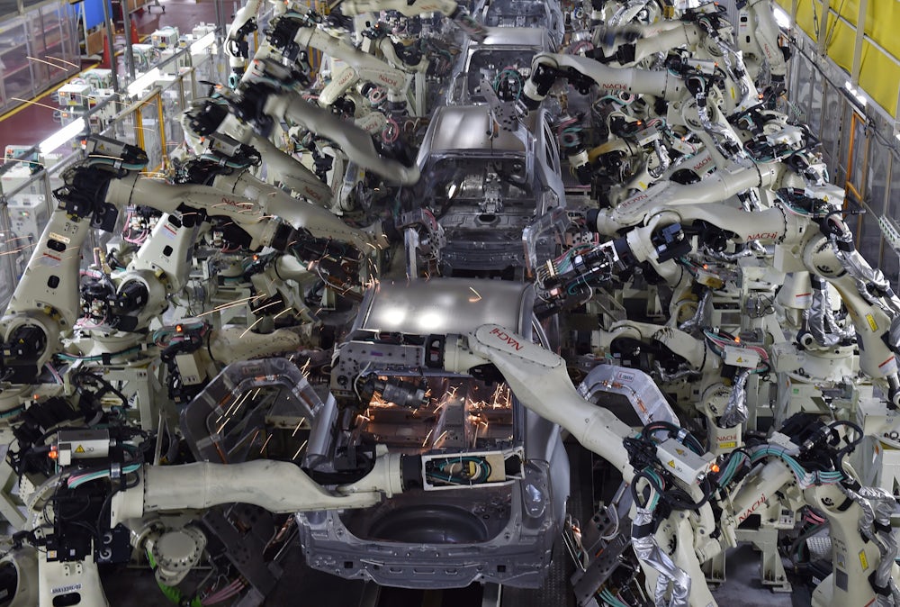 Automated welding machines assemble automobile bodies at Toyota Motor's Tsutsumi plant.