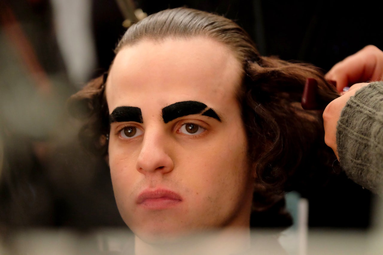 A model preparing backstage at Hood By Air's Fall 2016 show at New York Fashion Week.