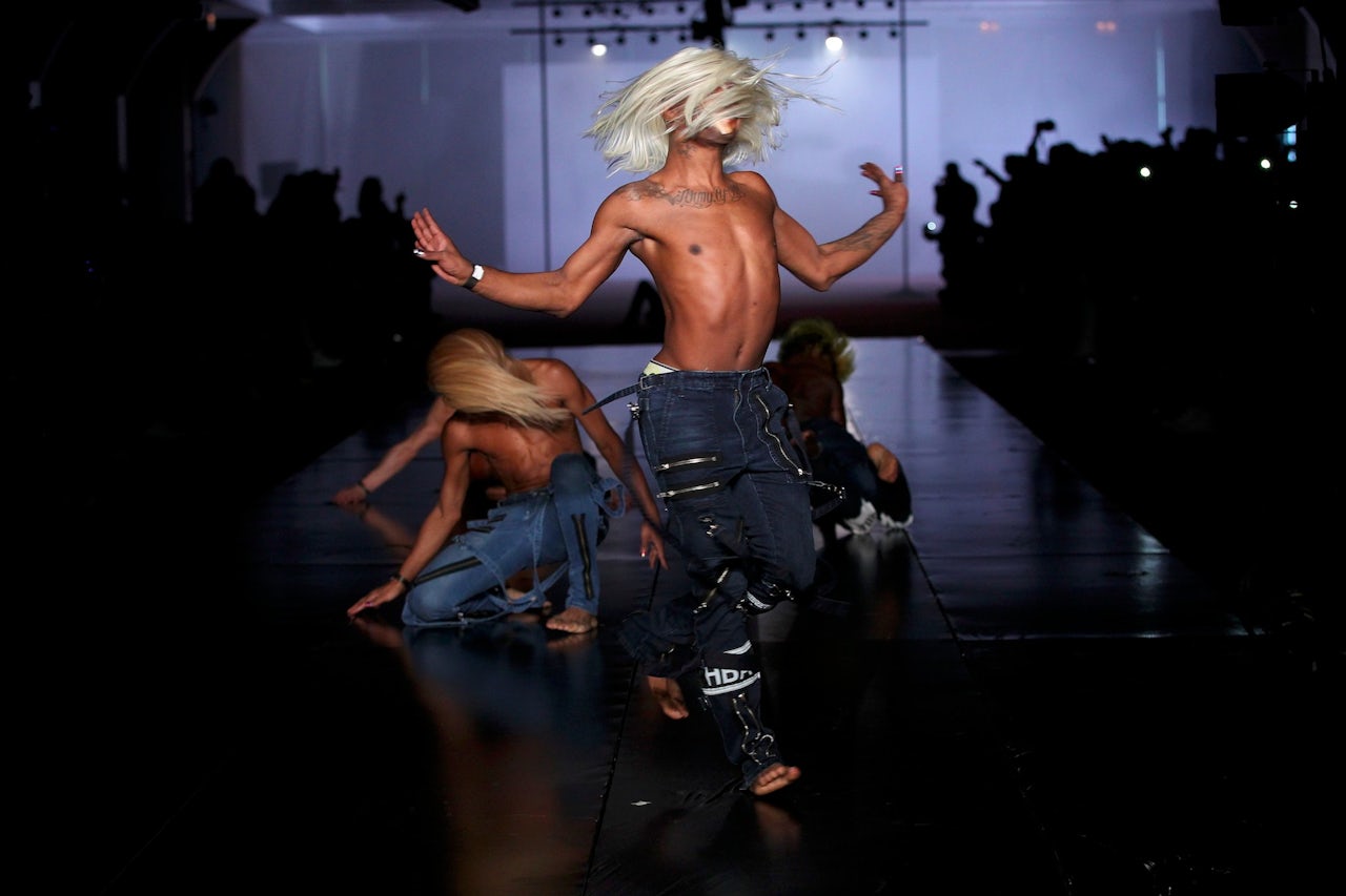 Models voguing at Hood By Air's Fall 2014 fashion week show.