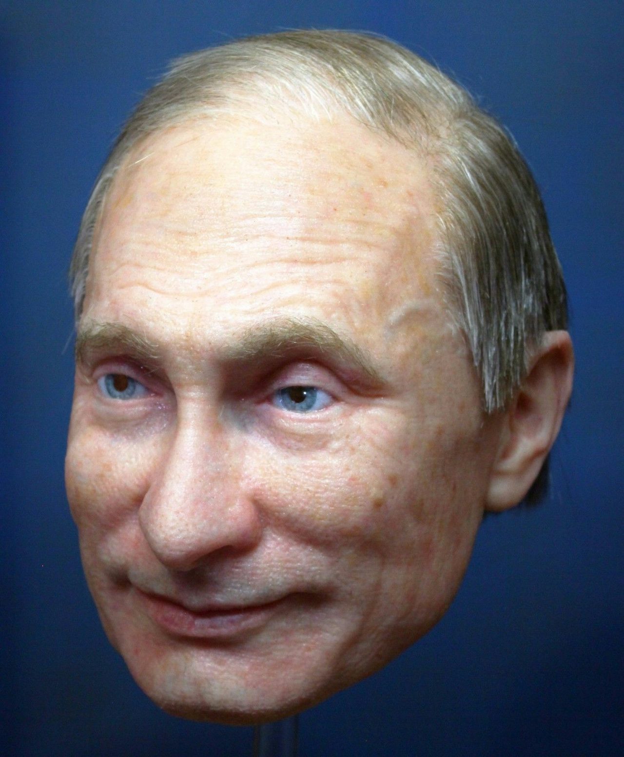 A realistic mask of Vladimir Putin.