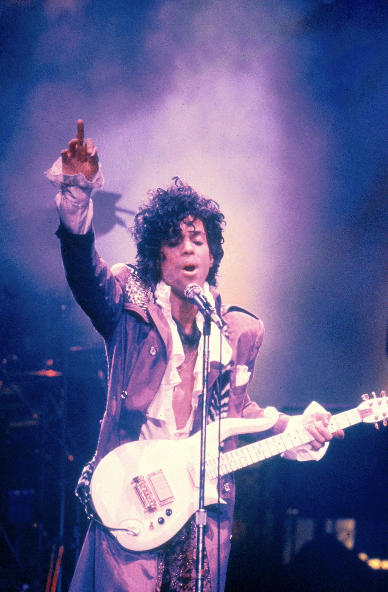 Prince performing on stage at the Ritz Club.
