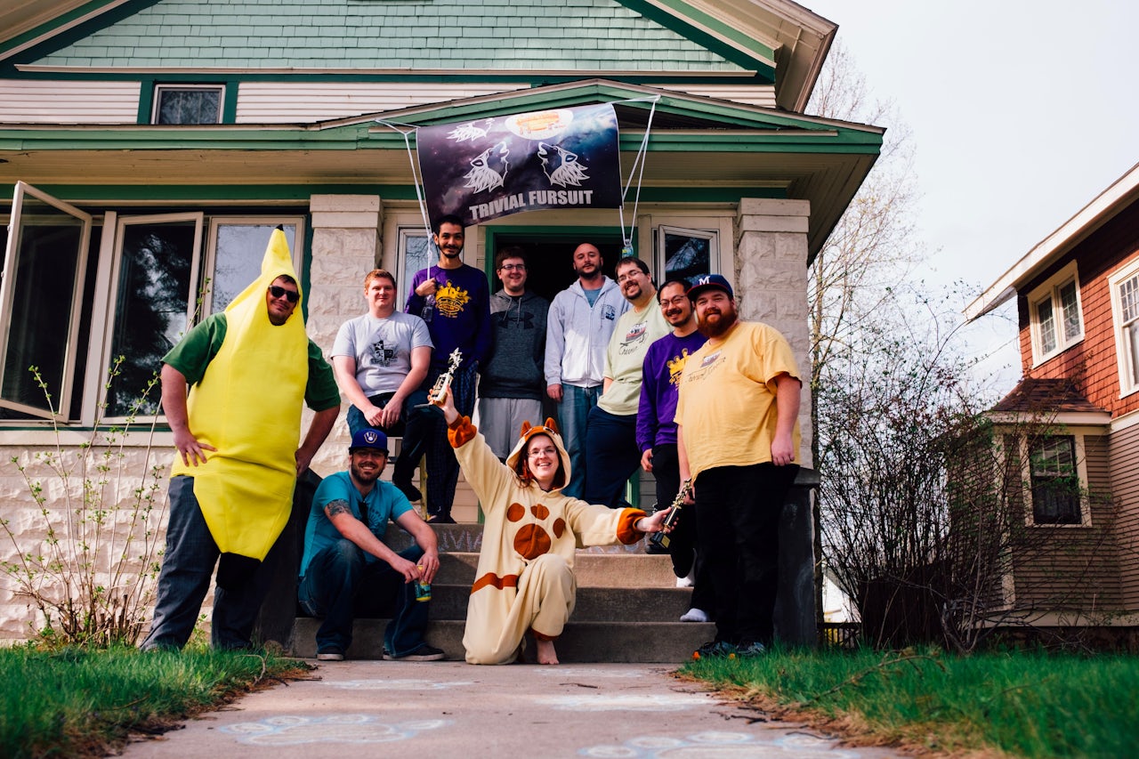 Members of Trivial Fursuit stand in front of their headquarters in Stevens Point, Wisconsin.
