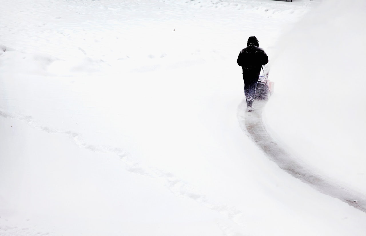 A man plows snow in Millennium Park in Chicago.