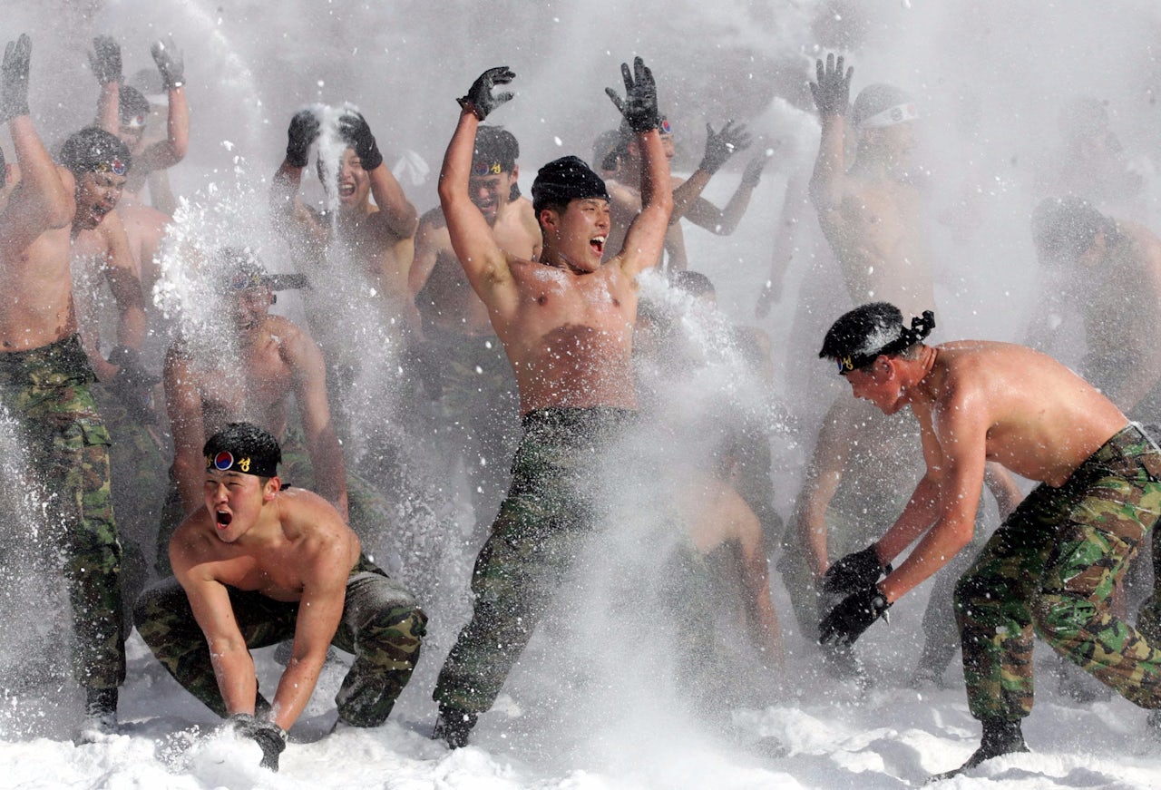 Soldiers play in the snow in PyeongChang, South Korea.
