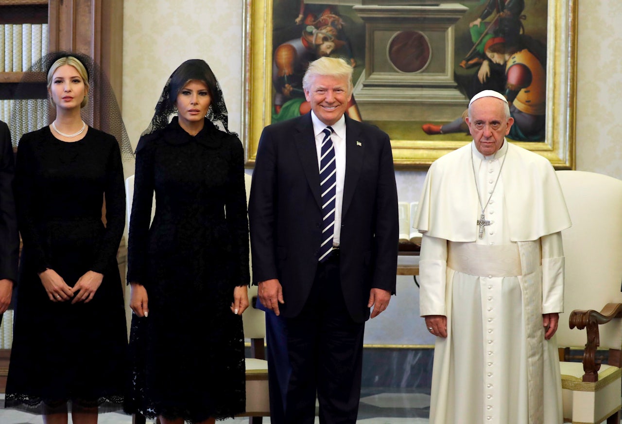 President Trump, his wife Melania, and his daughter Ivanka posing for a picture alongside Pope Francis at the Vatican.