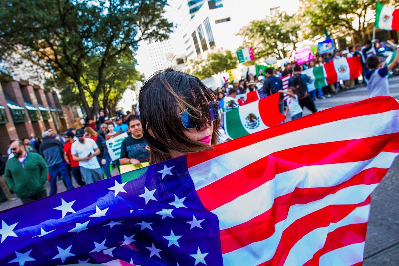 'A Day Without Immigrants' demonstrators march outside the Texas State Capitol on February 16, 2017.