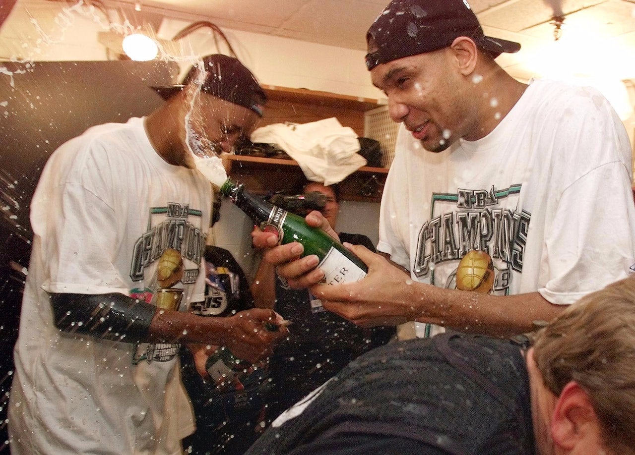 From left: Sean Elliott and Tim Duncan of the San Antonia Spurs pop champagne after Game 5 of the 1999 NBA Finals.