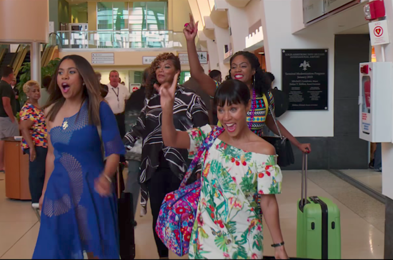 There is a similar strut-with-suitcases scene in Girls Trip.