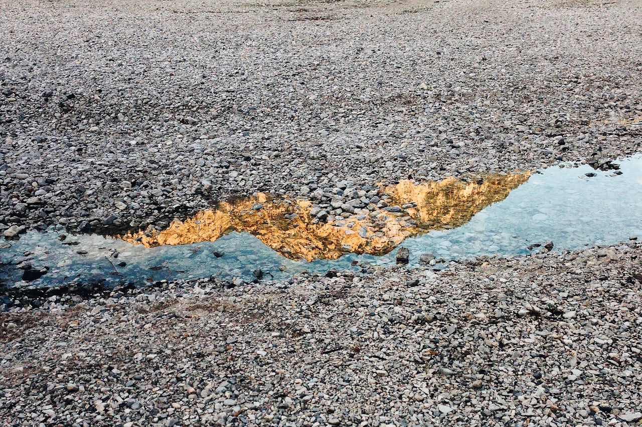 A reflection of a golden peak in Austria.