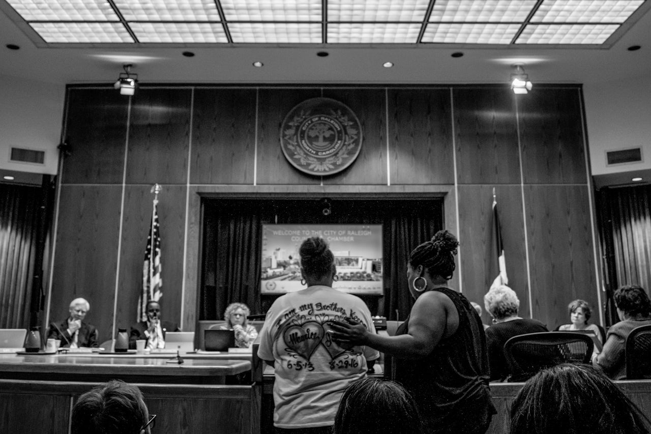 Aisha Flood and Rolanda Byrd at the Raleigh council meeting on March 7.