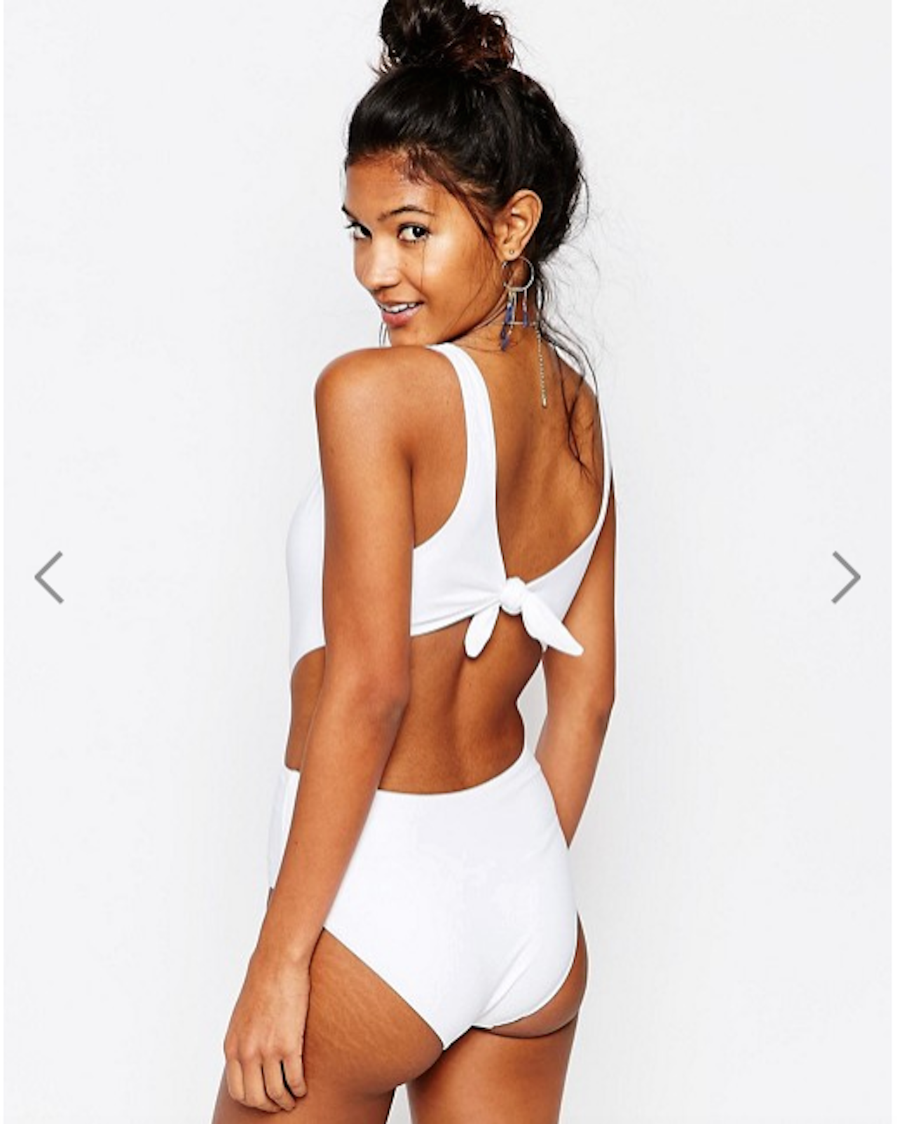 A model wears an ASOS swimsuit.