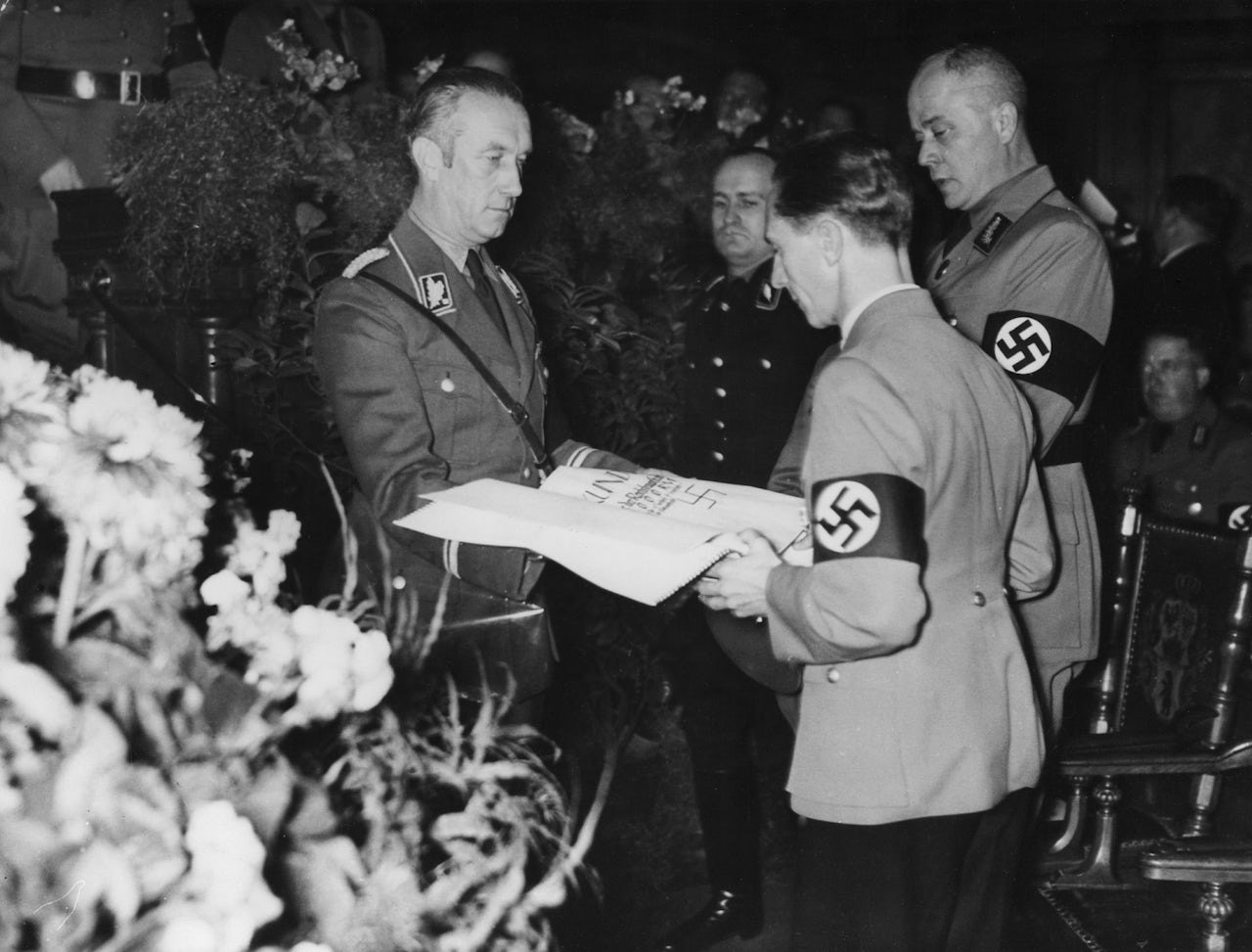 Joseph Goebels receives an oversized check in 1936, in what may be the earliest archived photo of such a check.