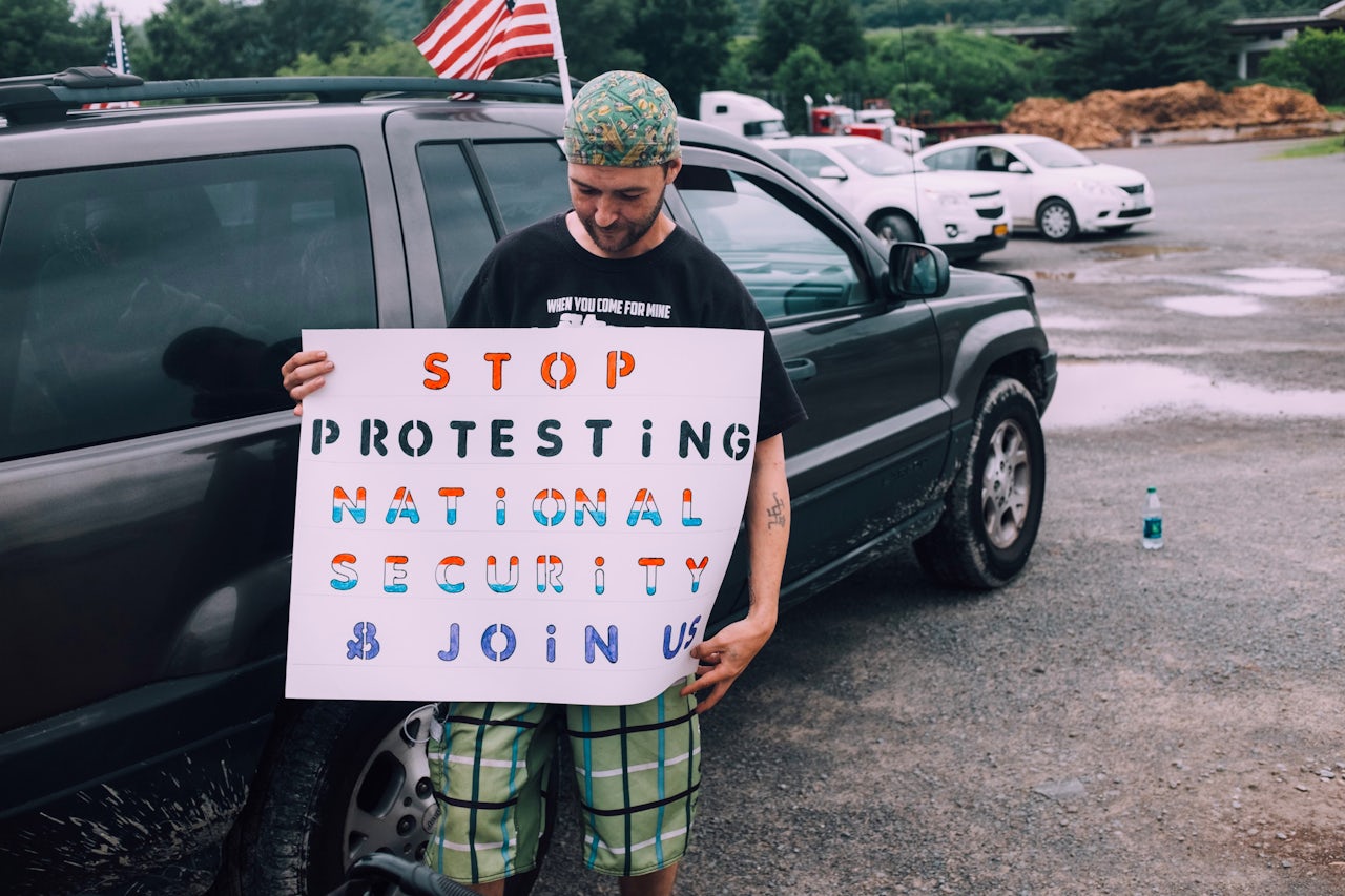 Joshua Lowery, who woke up at 3 a.m. on the day of the rally and drove in from Maine, with his sign.