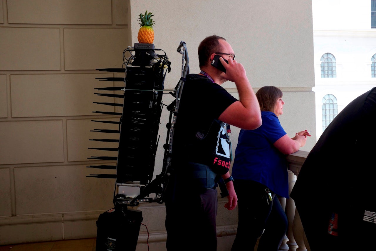 Mike Spicer wearing the Wi-Fi cactus, a device built to analyze Wi-Fi hacking in the wild.