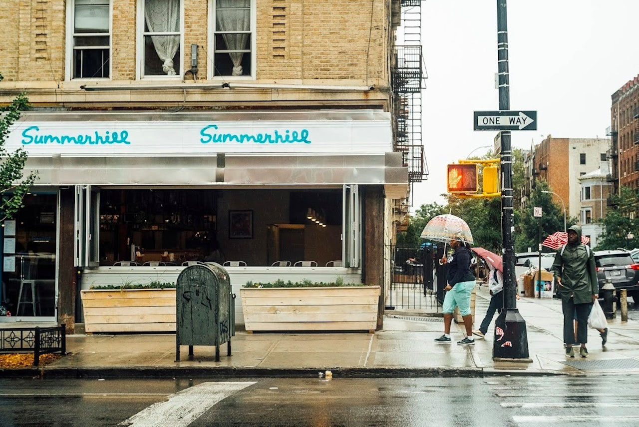 The writer outside of Summerhill in Crown Heights, Brooklyn.