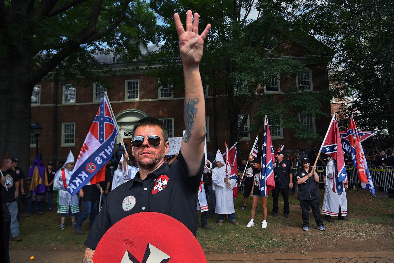 A KKK group from North Carolina called the Loyal White Knights protesting the removal of Civil War memorials in city parks. This KKK member gave a “White Power” salute in response to counter-protestors. Fewer than 50 KKK members reportedly attended but hundreds showed up against them.
