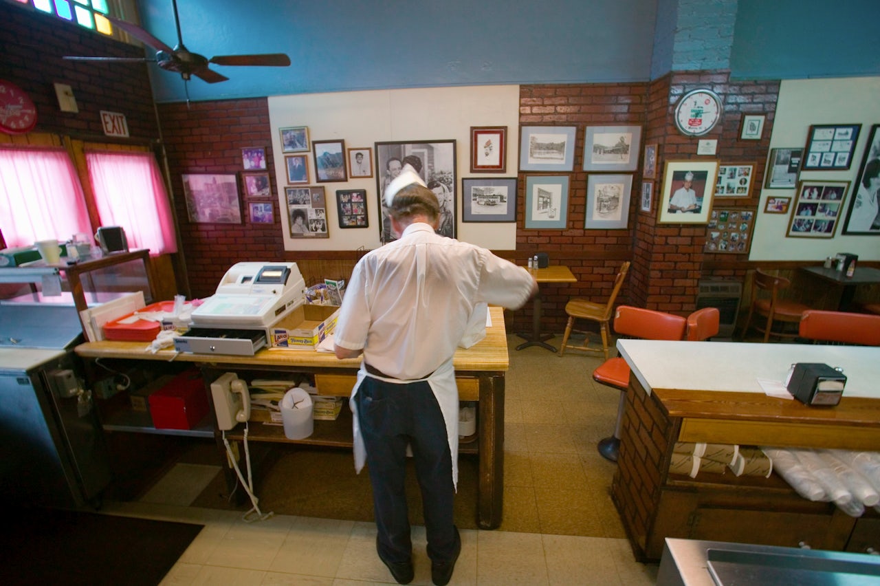 A cashier at work at a restaurant in Mt. Airy, North Carolina.