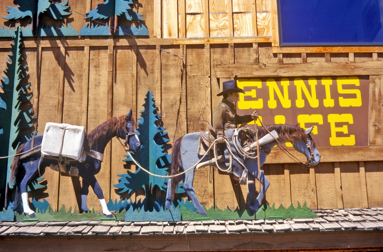 A Western scene decorates the exterior of the Ennis Cafe in Ennis, Montana.