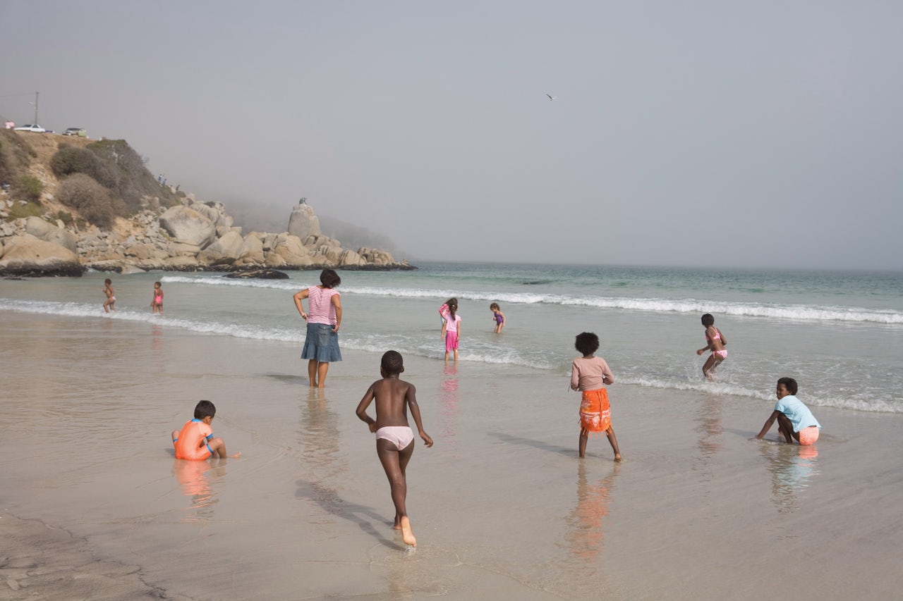 Children play on a Cape Town beach that was once whites-only.