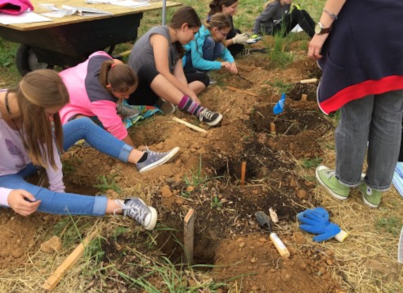 Forensic camp attendees examine samples at Oak Hill Cemetery.