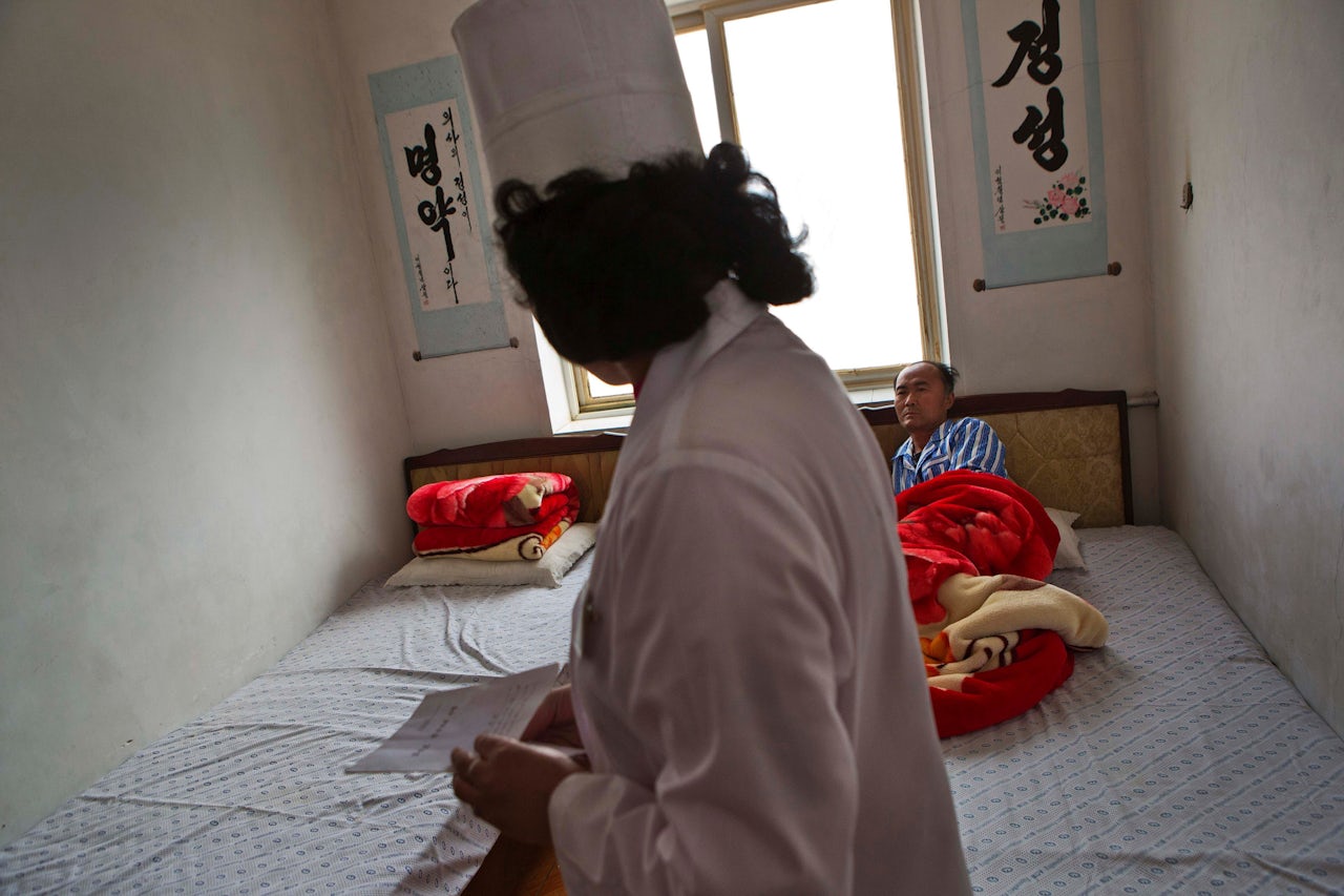 A doctor visits a patient at a village clinic in Ryongsan-ri, North Hwanghae province, about 40 kilometers (25 miles) southeast of Pyongyang, North Korea.