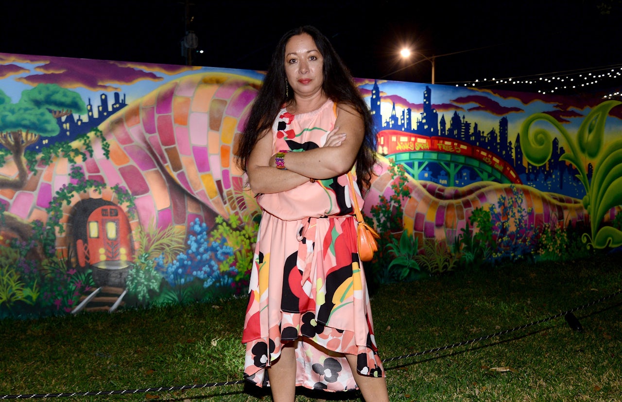 Lady Pink in 2013 with a mural she painted in Miami.