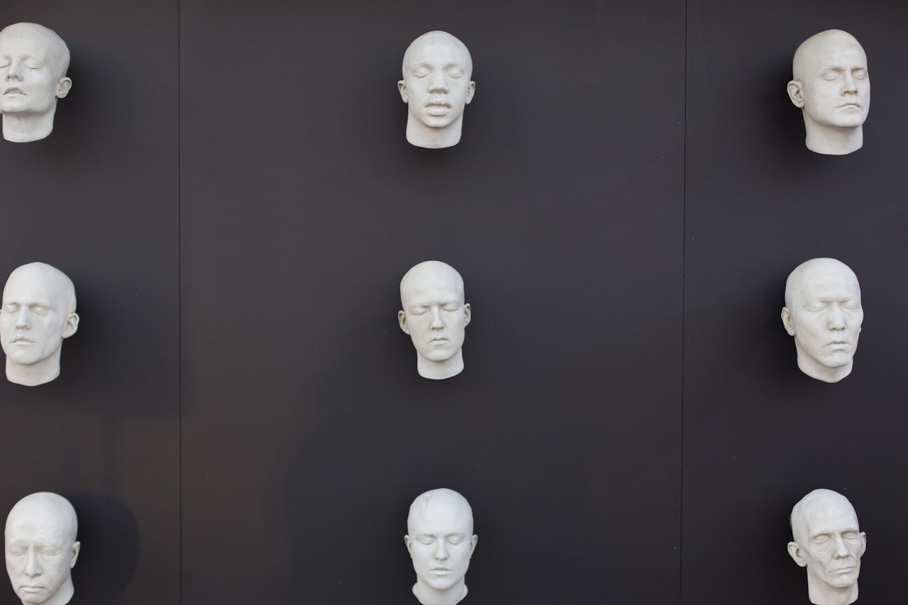 The robotic faces of unfinished “hosts.”