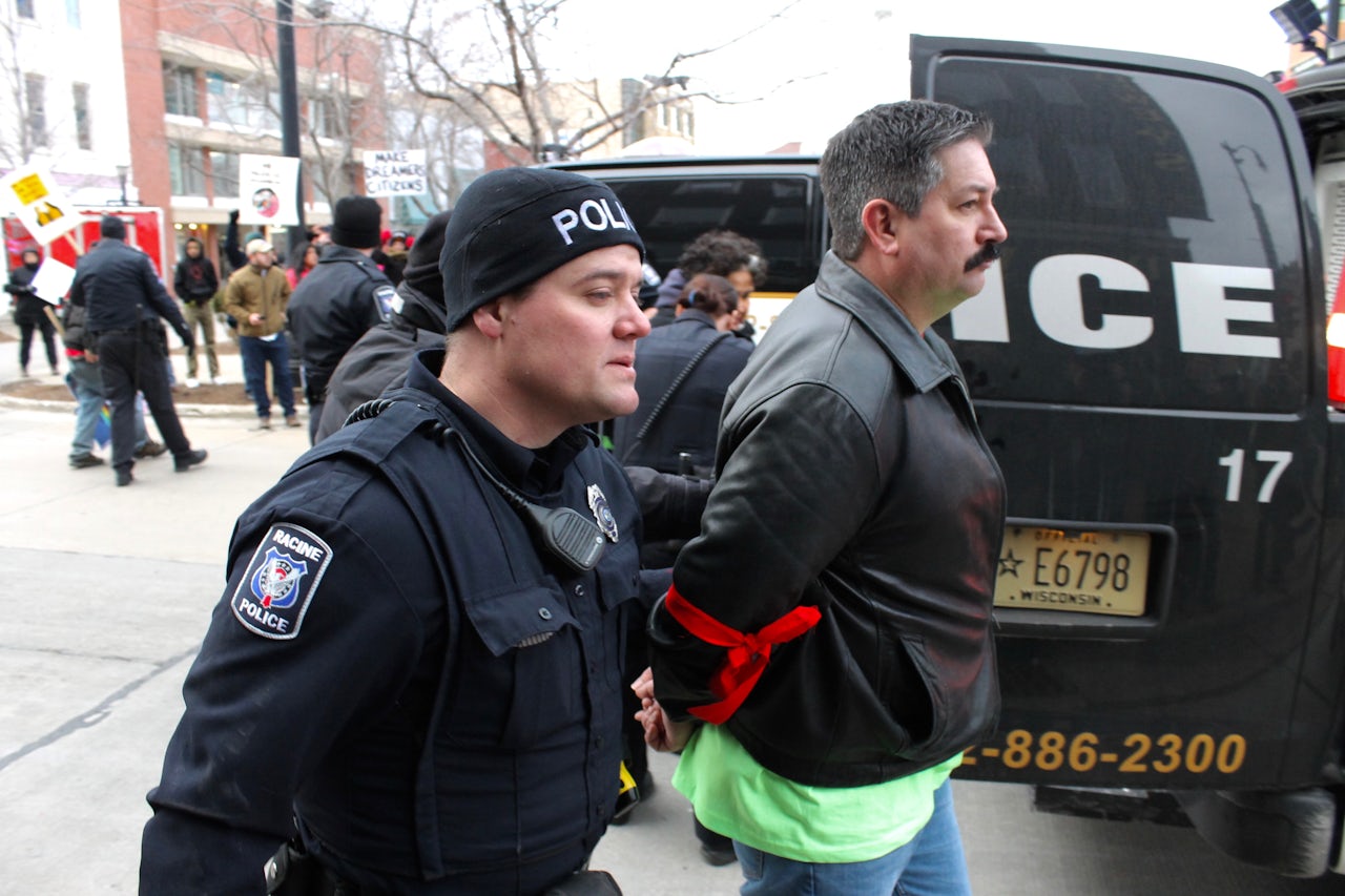 Randy Bryce being taken away by police after being arrested at a peaceful protest in support of Dreamers.