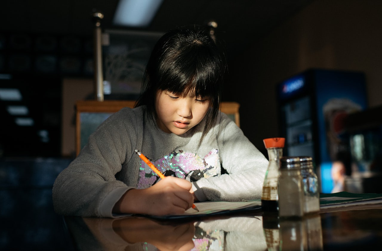The kids use the dining area to do their work since they don't have their own rooms or space at the restaurant.