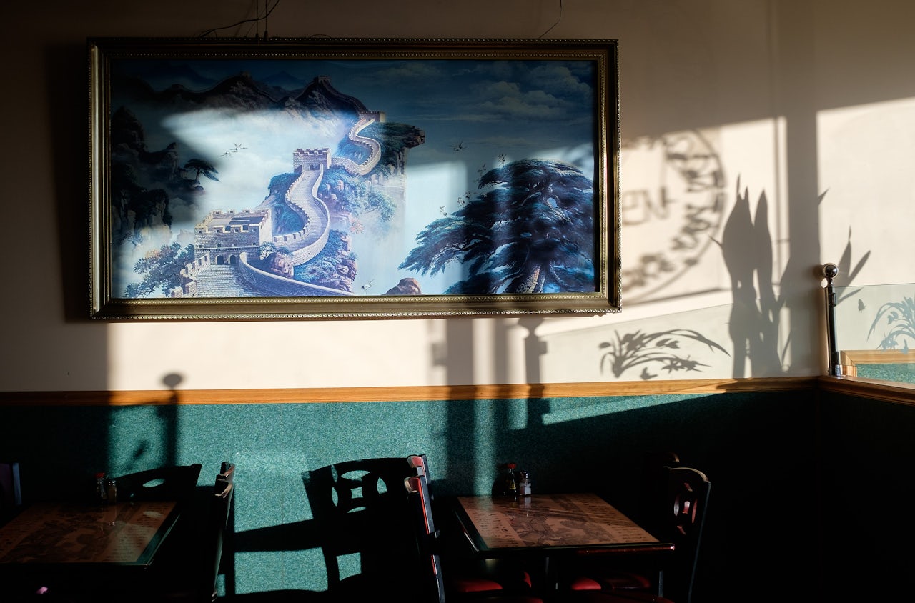 The sun falls in the empty dining area of a Chinese restaurant in central Pennsylvania. The town is home to around 2,500 people and this is one of the main restaurants.