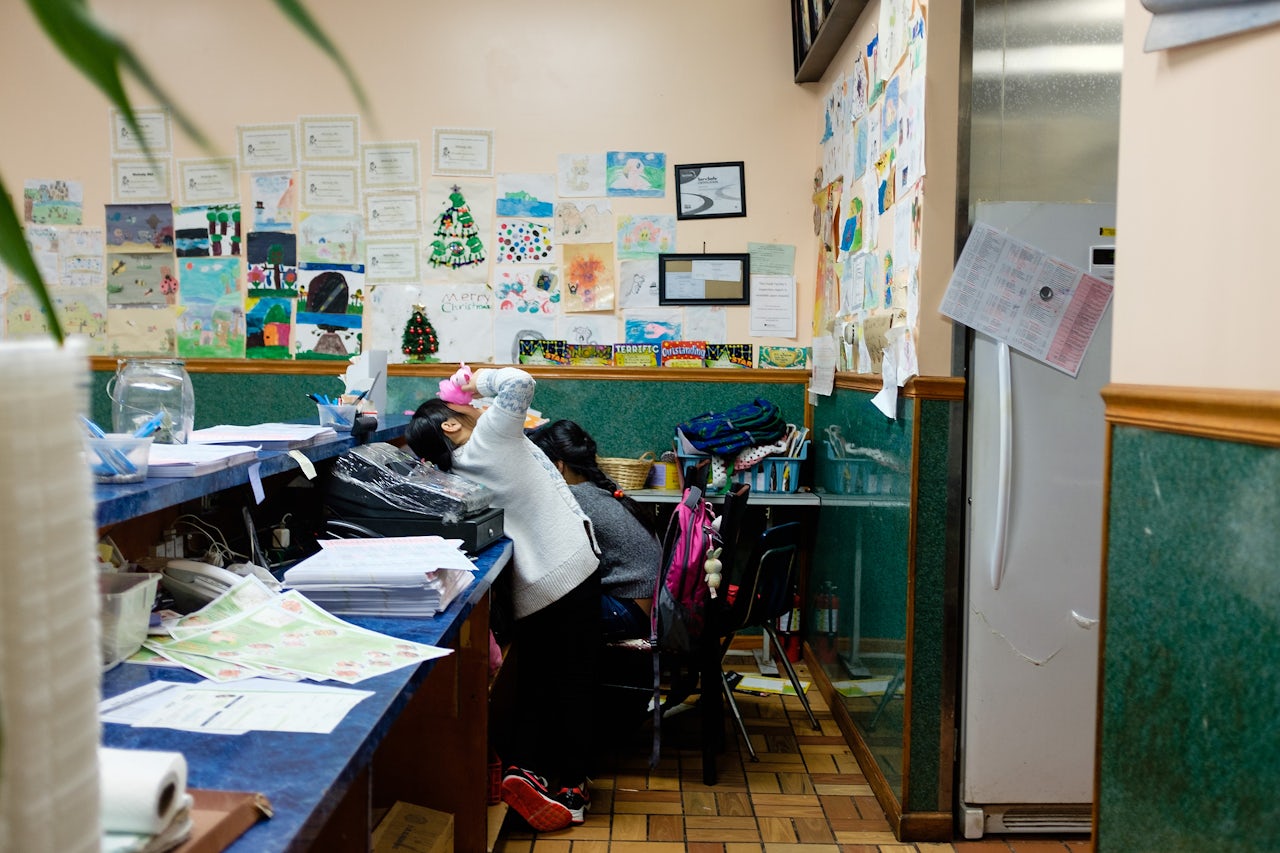The walls of the restaurant are covered by the children's drawings, awards and decorations.