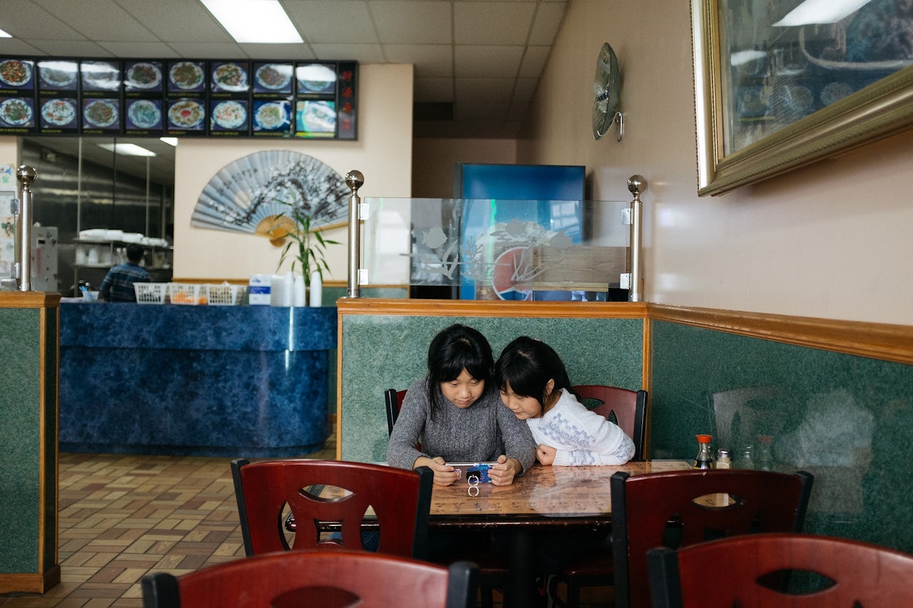 If they finish their homework, the kids will often watch videos on their cellphones.