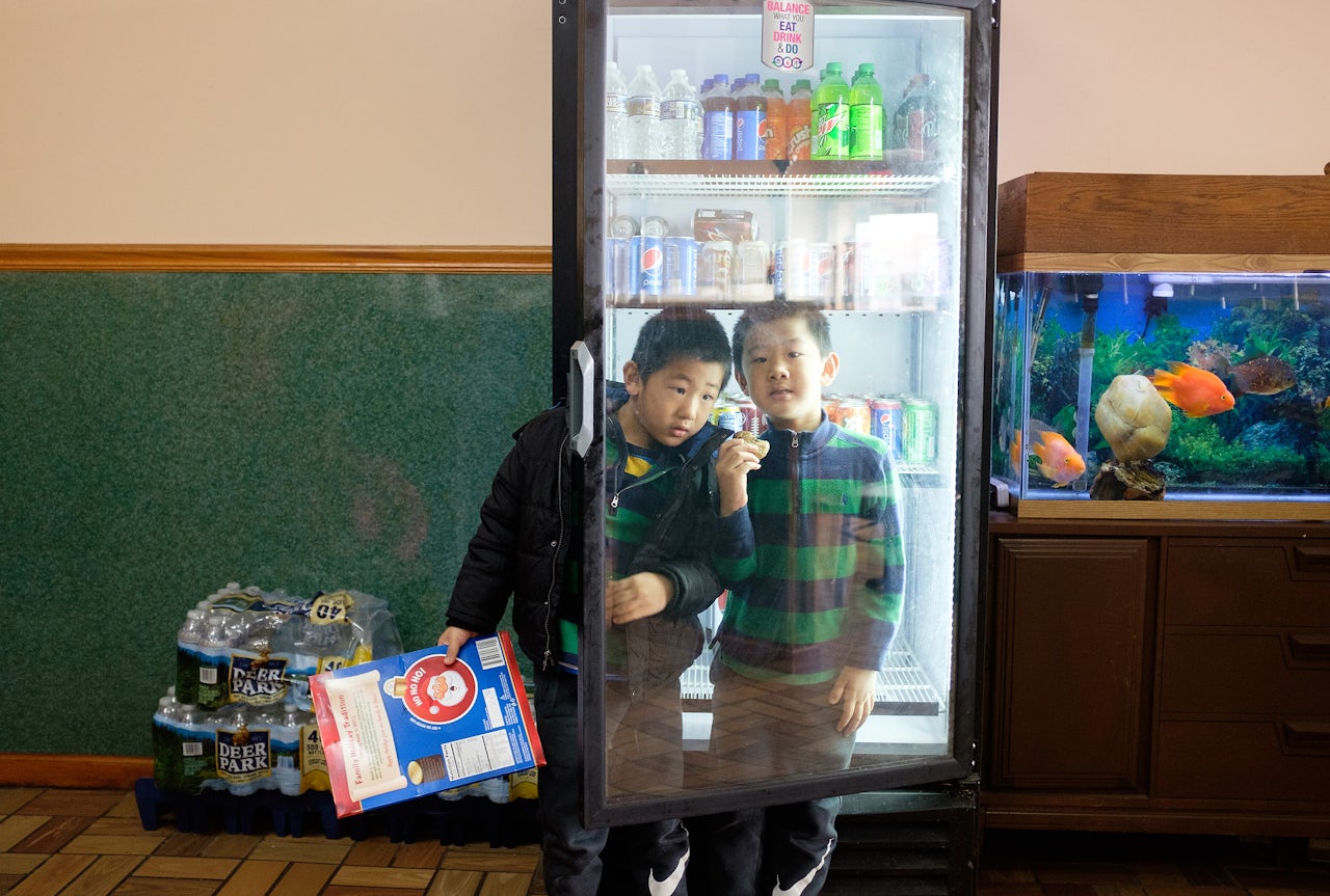 It isn't unusual to see the kids playing in their restaurant. This is where they can play, study, and spend time with family.