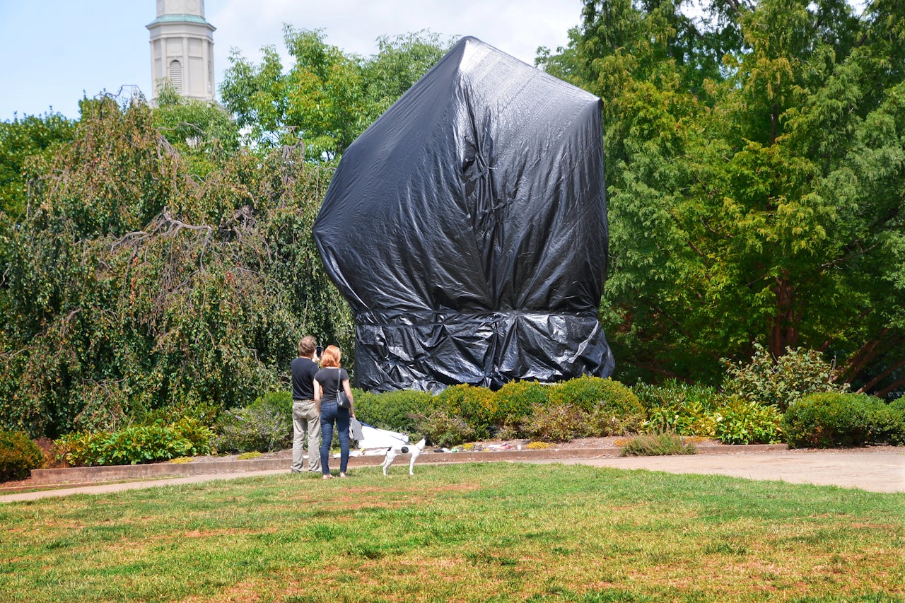 A tarp covering the statue of Confederate General Robert E. Lee in Charlottesville's Emancipation Park after the Unite the Right rally. 2017.