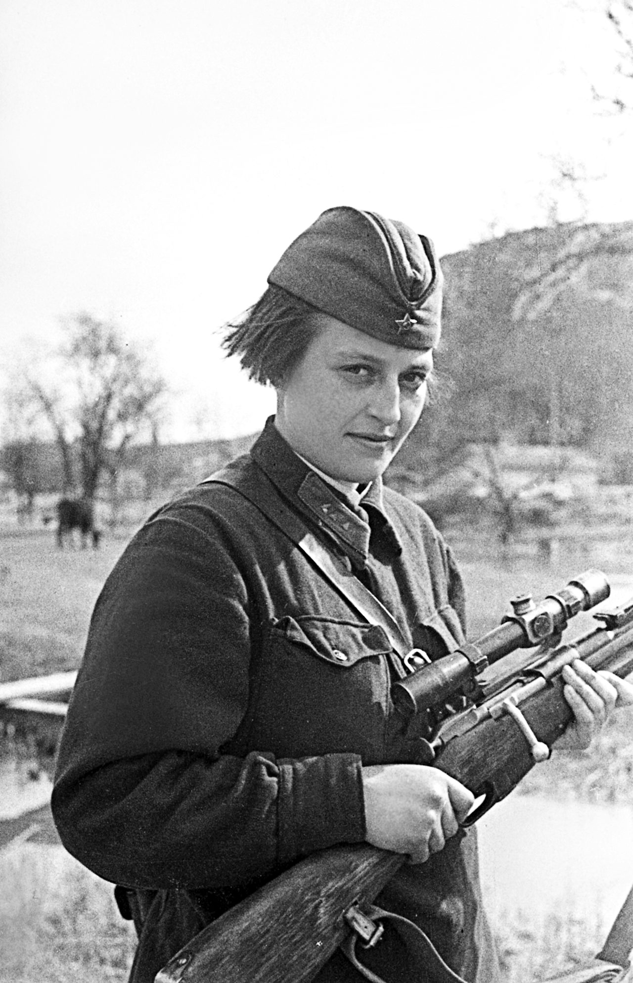 Lyudmila Pavlichenko posing with her rifle.
