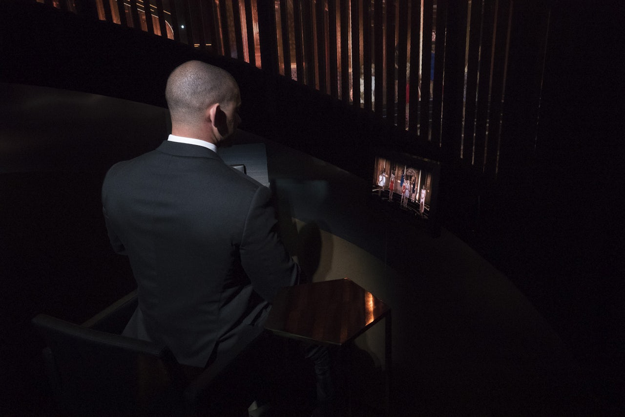 Contestant Michael observes his choices of women from inside the pod.