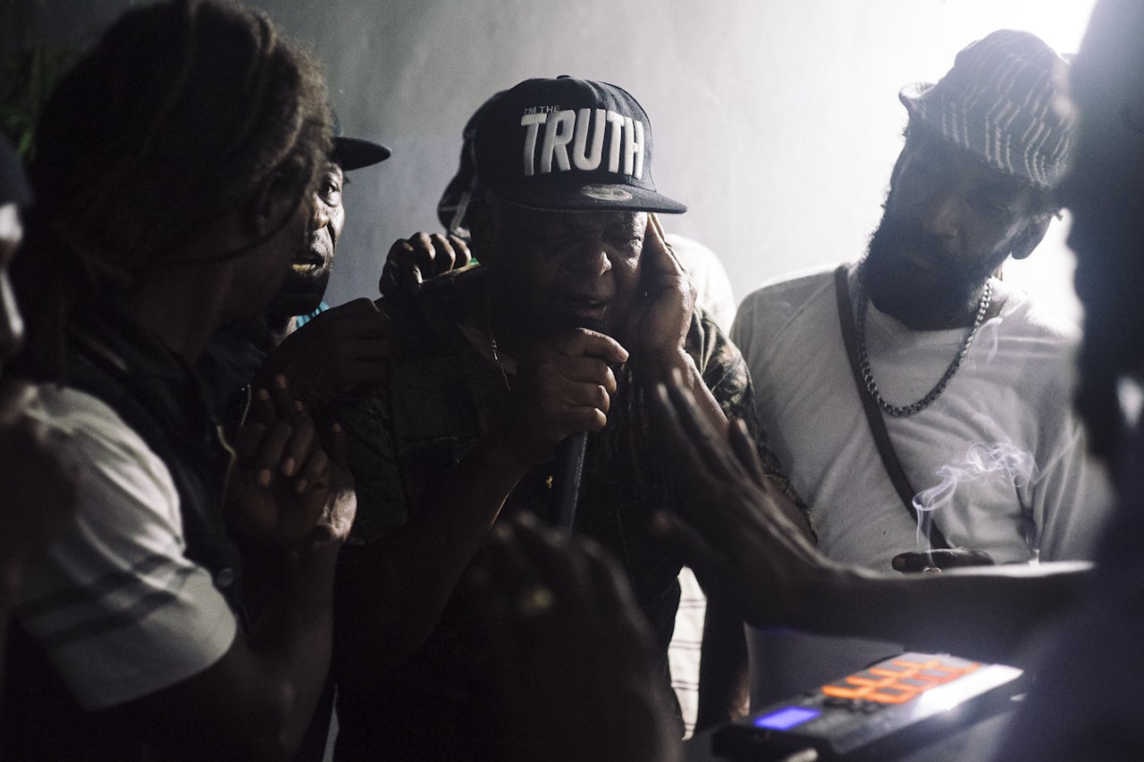 DJs including Danny Dread (far right) chat in a classic style over instrumental versions of classic reggae and dancehall played on 7” vinyl at Caveman Studios.