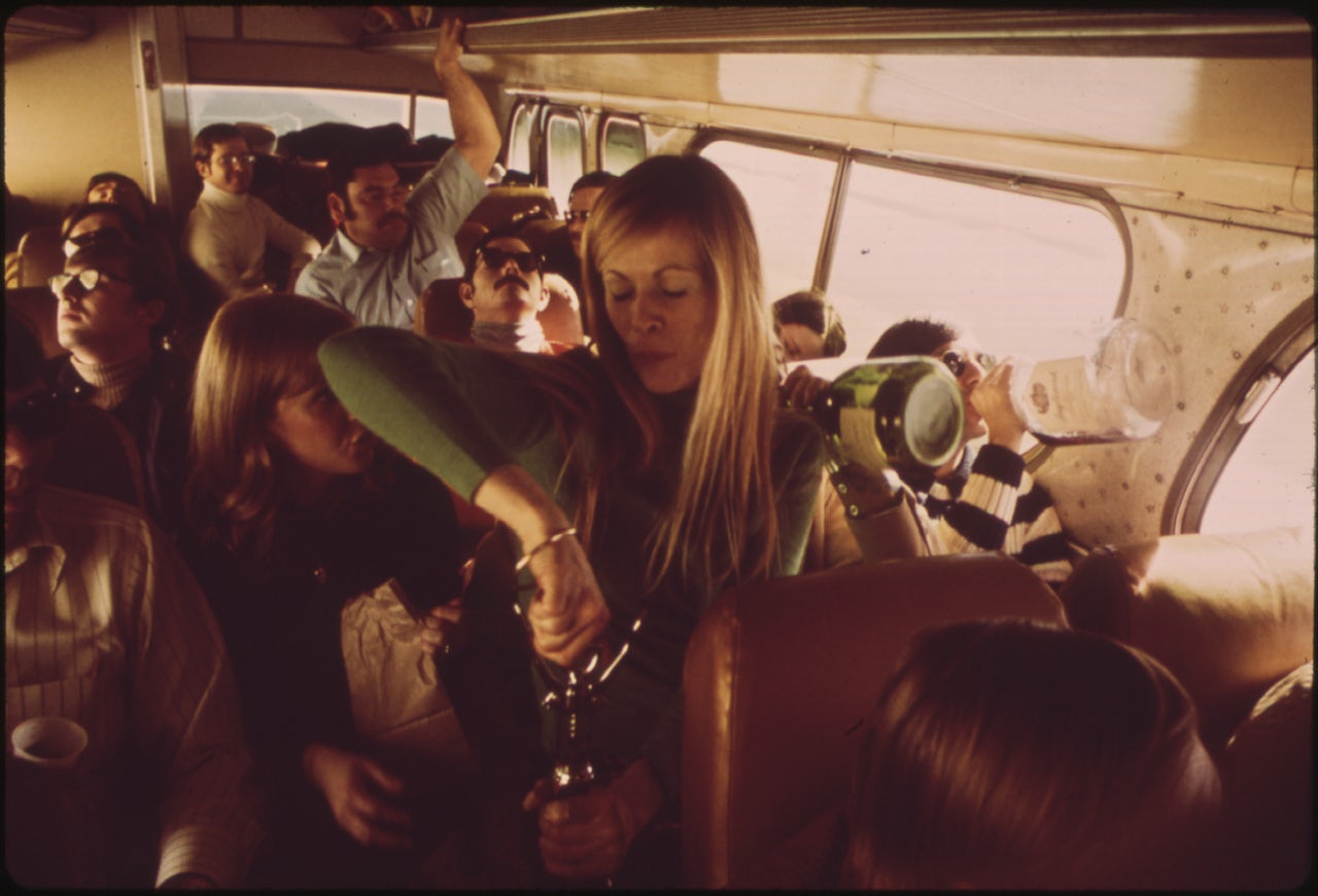 Young people drinking on a bus, circa 1974.