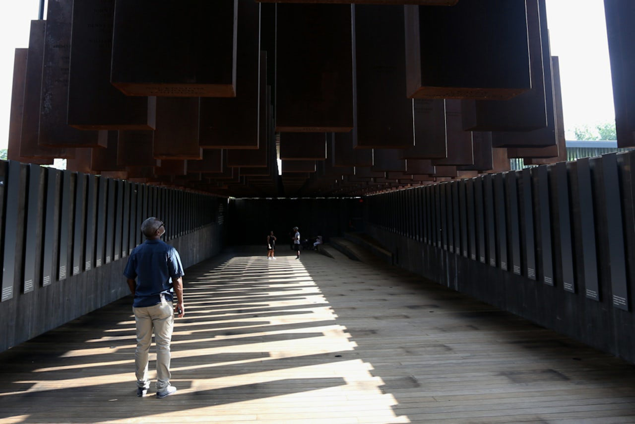 A visitor at the National Memorial for Peace and Justice.